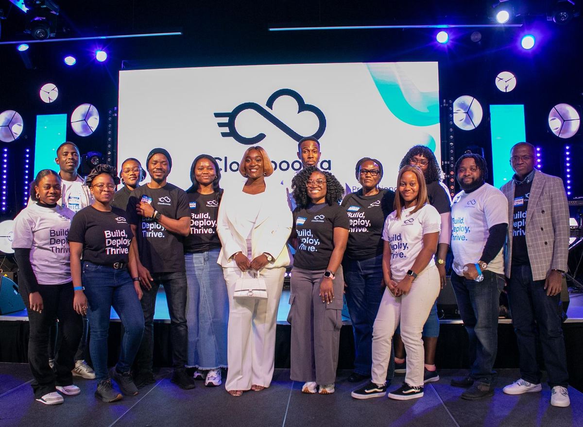 The Cloudboosta team on stage at Cloud DevOps Connect, London, 2024